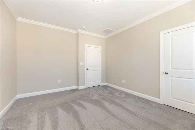 carpeted empty room with ornamental molding