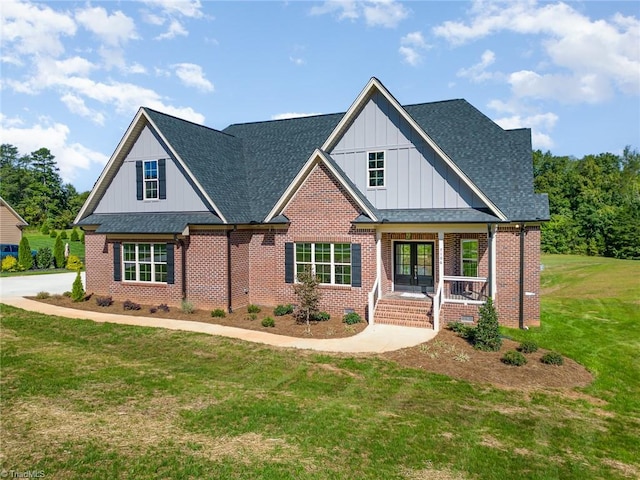 view of front of house featuring covered porch and a front lawn