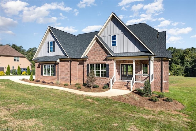 view of front of home featuring a front lawn and covered porch