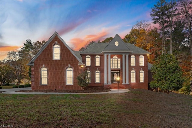 view of front of property with a yard