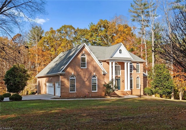 view of front of house featuring a garage and a front yard