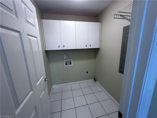 washroom with washer hookup, cabinet space, light tile patterned flooring, baseboards, and hookup for an electric dryer