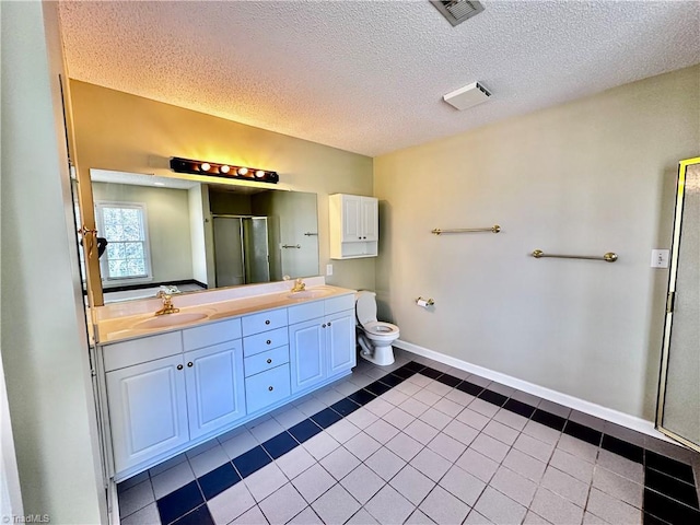 bathroom featuring a sink, visible vents, double vanity, and a shower stall