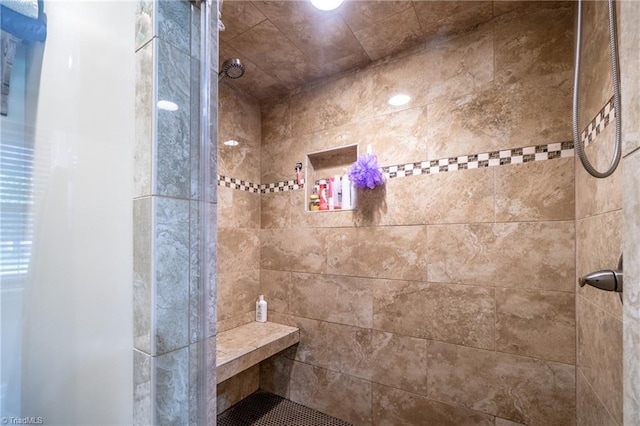 bathroom featuring tiled shower