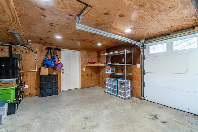 garage featuring wooden walls