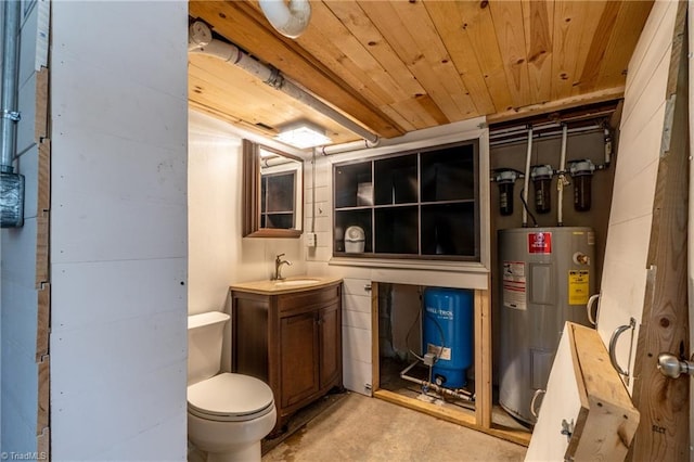 bathroom featuring water heater, vanity, wooden ceiling, concrete flooring, and toilet