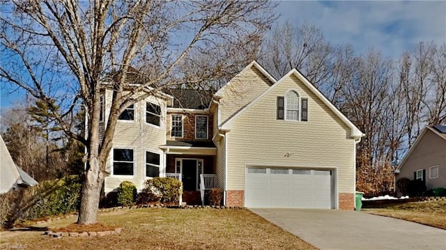 front of property featuring a front yard and a garage