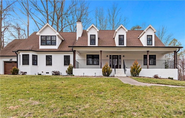 view of front of home featuring roof with shingles, a chimney, a porch, a front yard, and a garage