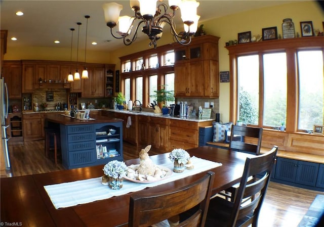 1564 Thore Rd, Pinnacle, NC 27043 - kitchen with a chandelier, an island with sink, open shelves, decorative backsplash, and recessed lighting