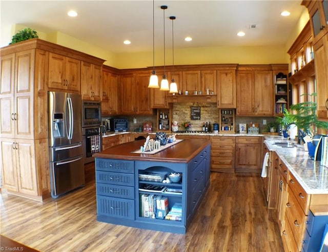 1564 Thore Rd, Pinnacle, NC 27043 - kitchen with stainless steel appliances, open shelves, wood finished floors, a center island, and a sink