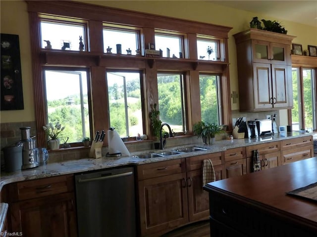 1564 Thore Rd, Pinnacle, NC 27043 - kitchen with dishwashing machine, a sink, decorative backsplash, light stone counters, and glass insert cabinets