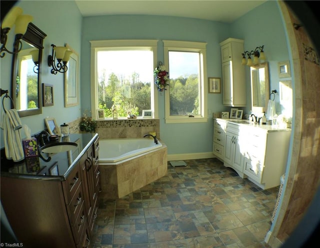 1564 Thore Rd, Pinnacle, NC 27043 - full bath with a bath, two vanities, stone finish floors, and baseboards