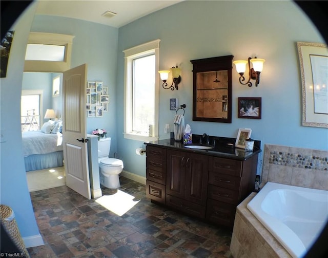 1564 Thore Rd, Pinnacle, NC 27043 - bathroom with a garden tub, vanity, toilet, and stone finish floors