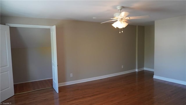 unfurnished room with vaulted ceiling, ceiling fan, and dark hardwood / wood-style floors