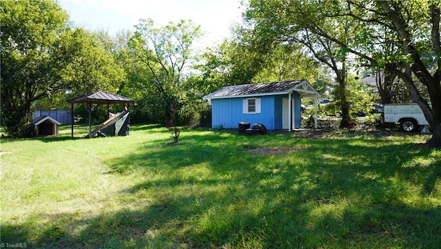 view of yard with a playground and a storage shed