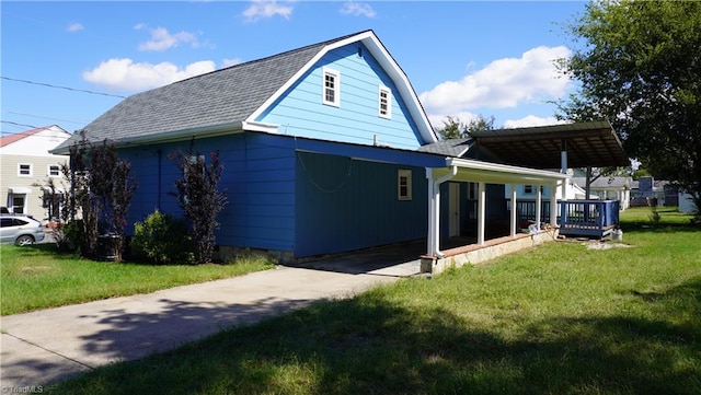 view of side of home with a lawn