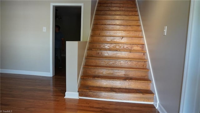 stairs with hardwood / wood-style floors