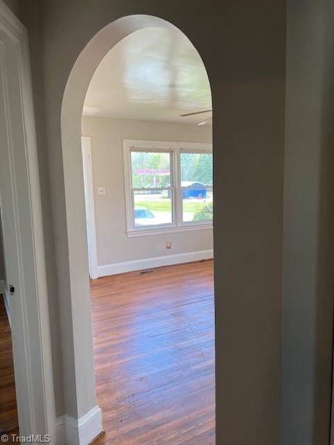 spare room featuring wood-type flooring