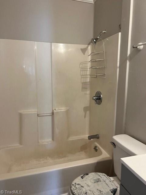 full bathroom with  shower combination, vanity, and toilet