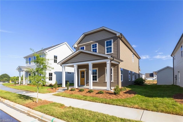 view of front of property featuring a porch and a front yard