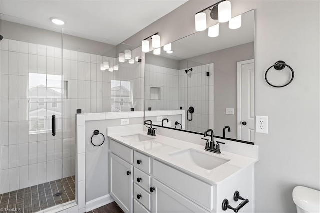 bathroom with vanity and a shower with shower door