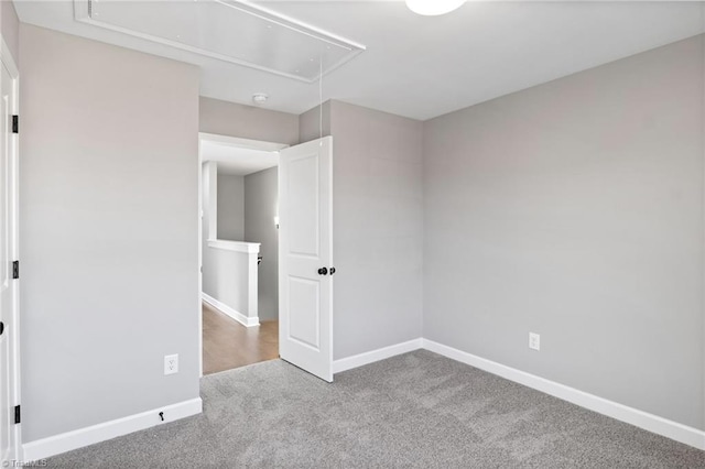 unfurnished bedroom featuring light carpet