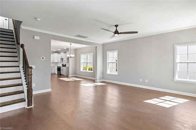 unfurnished living room with crown molding, ceiling fan with notable chandelier, and dark hardwood / wood-style flooring