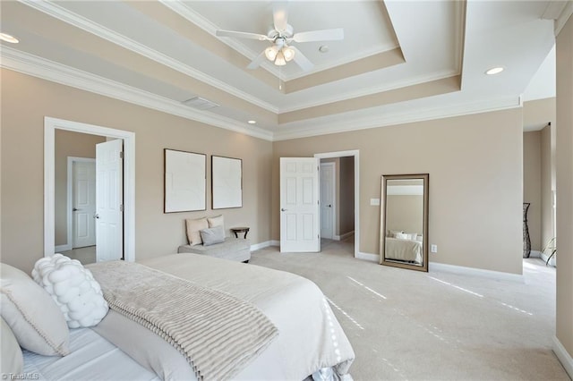 bedroom featuring visible vents, baseboards, a tray ceiling, ornamental molding, and light colored carpet