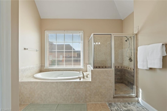 full bathroom with tile patterned flooring, a bath, and a stall shower