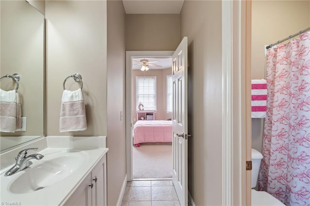 full bathroom with vanity, curtained shower, toilet, and tile patterned flooring