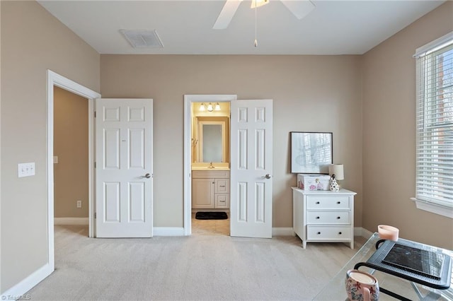 bedroom featuring multiple windows, light colored carpet, visible vents, and baseboards