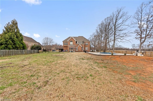 view of yard with a fenced in pool and a fenced backyard