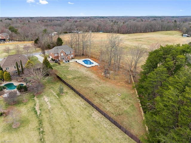 birds eye view of property with a rural view