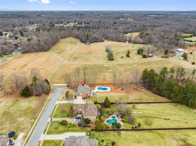 birds eye view of property with a rural view