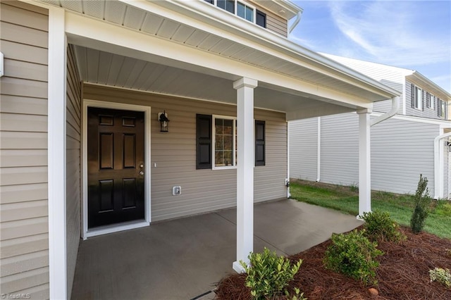 doorway to property featuring covered porch