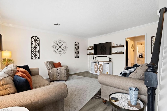 living room with wood-type flooring and ornamental molding