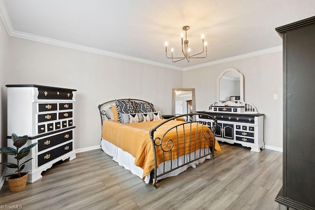 bedroom featuring wood-type flooring, a notable chandelier, and ornamental molding