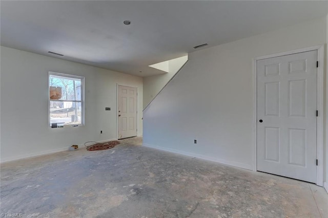 empty room with visible vents and baseboards