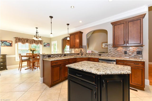 kitchen featuring stainless steel dishwasher, a sink, light tile patterned flooring, and tasteful backsplash