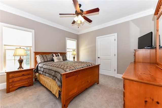 bedroom with crown molding, a ceiling fan, baseboards, and light colored carpet