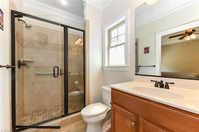 bathroom with crown molding, toilet, vanity, and a stall shower