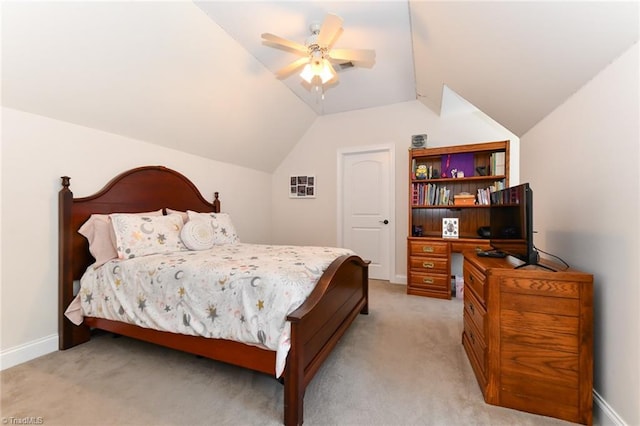 bedroom featuring baseboards, ceiling fan, light carpet, and vaulted ceiling