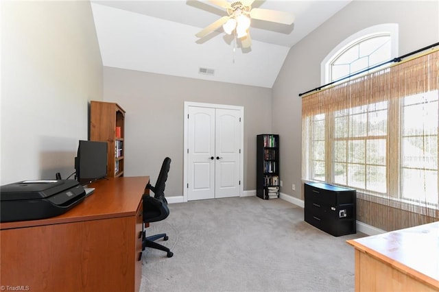office area with a healthy amount of sunlight, ceiling fan, vaulted ceiling, and visible vents