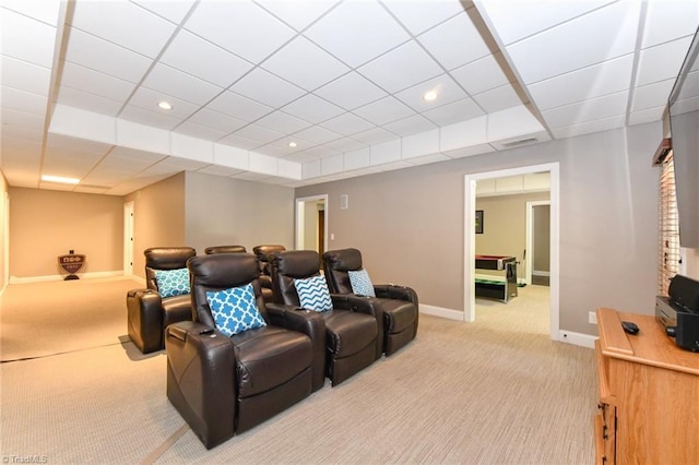 home theater with baseboards, carpet flooring, a paneled ceiling, and visible vents