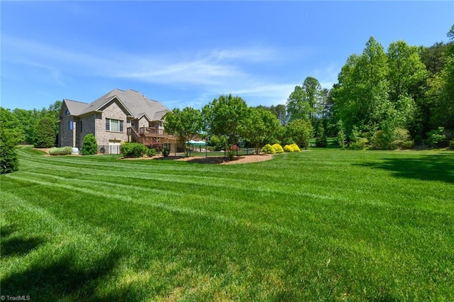 view of yard with a wooden deck
