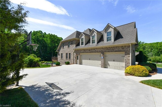 view of front of property with brick siding and driveway