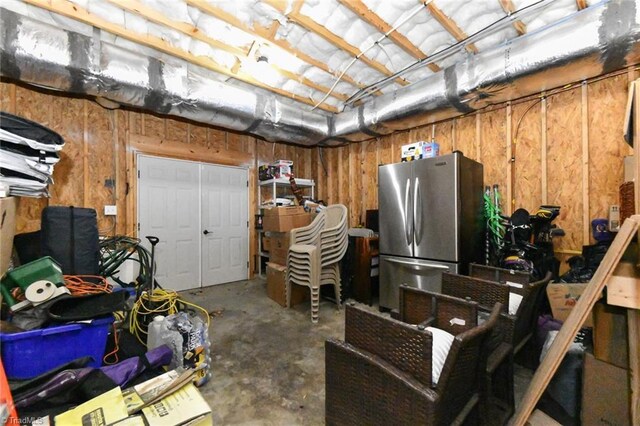basement with freestanding refrigerator