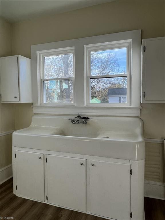 bathroom with hardwood / wood-style floors