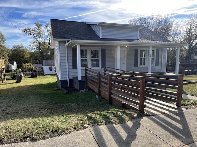 bungalow-style home featuring a front yard