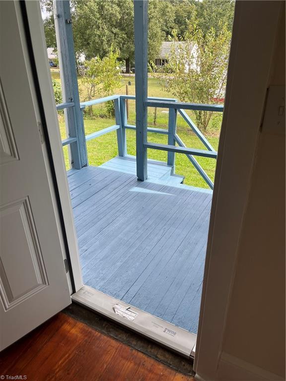 doorway to outside with dark hardwood / wood-style flooring